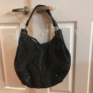 Chic and edgy genuine leather and metal chain hobo